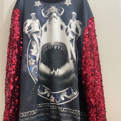 Sweatshirt with design and red sequin sleeves used