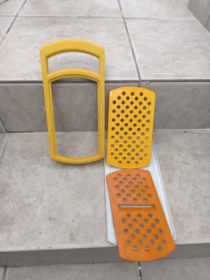 Tupperware grater with multiple cutting options