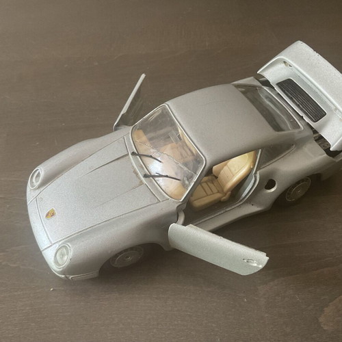 Burago metal toy car Porsche 959 M1:24 used with missing headlight and cracked glass
