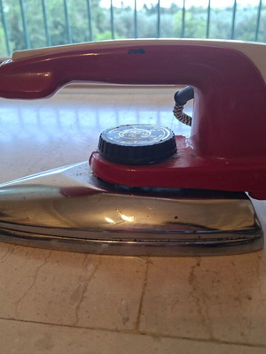 Marconi vintage hand iron used, with plate and cord