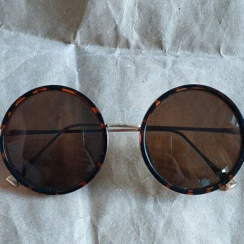 Faux sunglasses used, round with soft leopard pattern