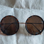 Faux sunglasses used, round with soft leopard pattern