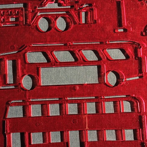Red plastic stencil with vehicle designs