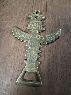 Brass bottle opener used in good condition