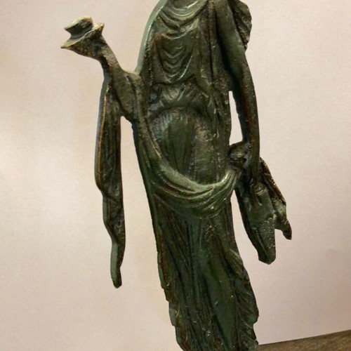 Decorative figurine of archaic/classical type used, bronze metal