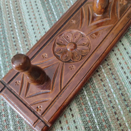 Vintage carved wooden coat rack with three hooks