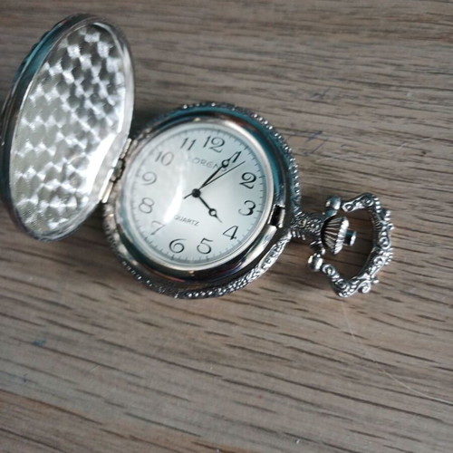 Old pocket watch like new with embossed pattern