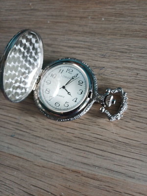 Old pocket watch like new with embossed pattern