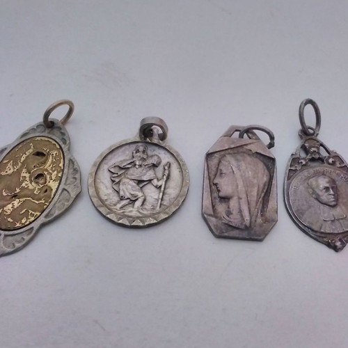 Silver pendant necklace used with zodiac and catholic figures