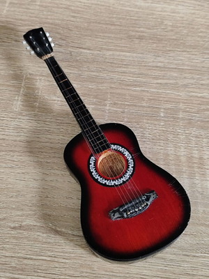 Wooden acoustic guitar miniature used for decoration