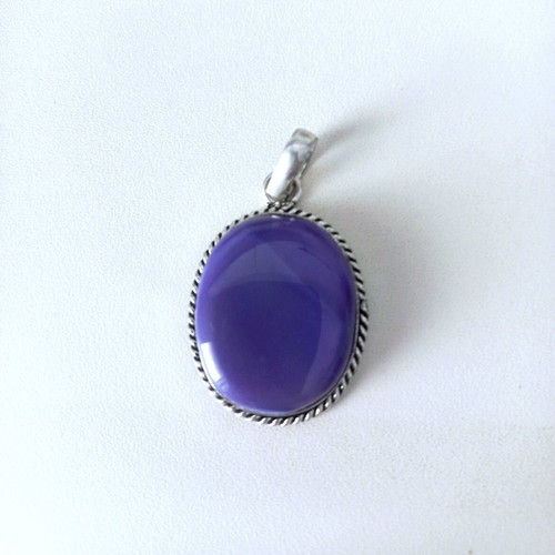 Silver pendant with purple stone used