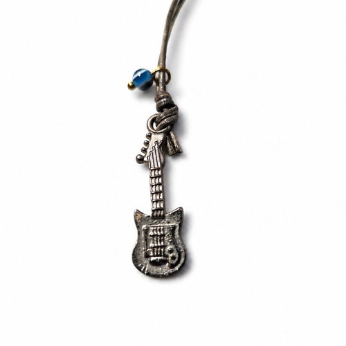 Guitar Keychain like new with metal detail and vintage blue eye