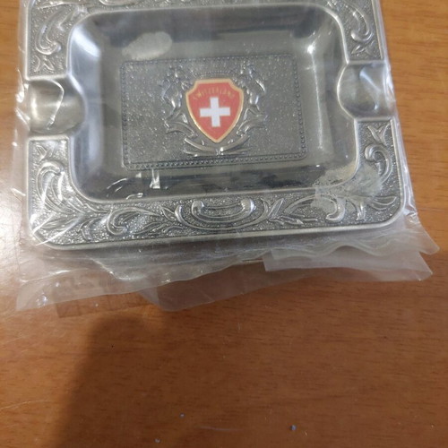 Collectible metal ashtray new with Switzerland emblem