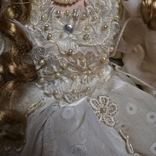 Glass Bride Doll like new with lace dress and hat