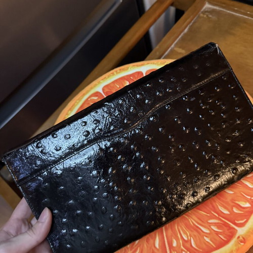 Black clutch bag like new with embossed texture
