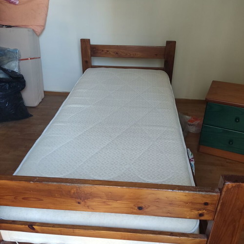Wooden single bed with anatomical mattress and bedside table like new