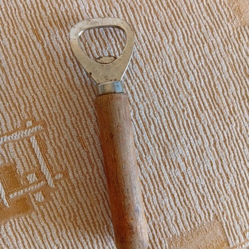 Classic bottle opener with wooden handle used