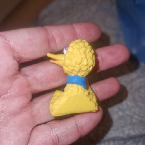 Big Bird figure from Sesame Street with blue scarf