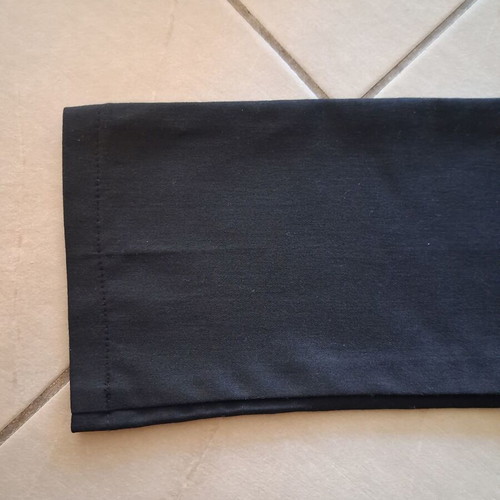 Access black pants like new with details on back pockets
