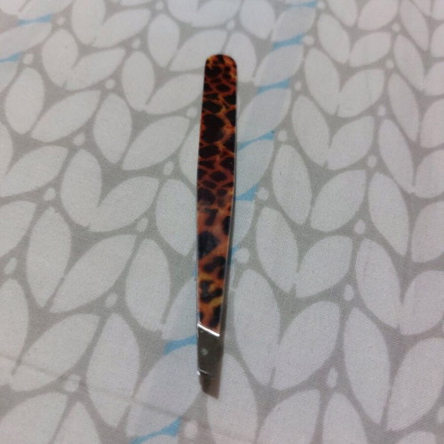 Tweezers leopard print like new