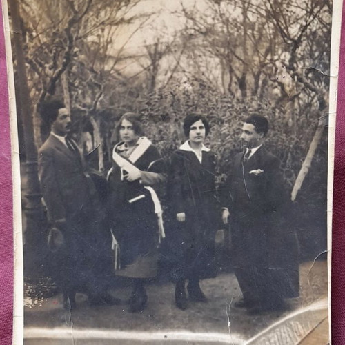 Vintage black and white photo used, group of four in park