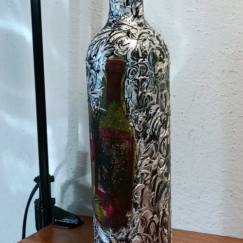 Painted wine bottle used for design
