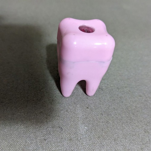 Children's tooth-shaped sharpener used, pink