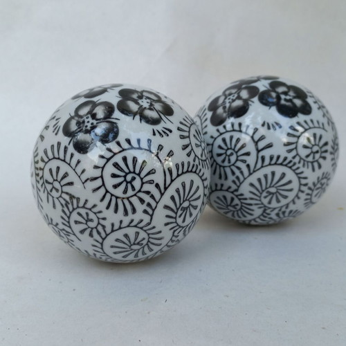 Vintage decorative porcelain spheres set like new with floral and geometric designs