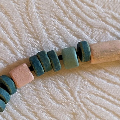 Handmade necklace used with beads in pink, sky blue, and green shades