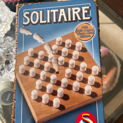 Solitaire game like new with wooden board and pegs in tin box