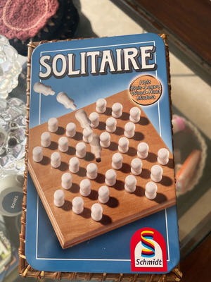 Solitaire game like new with wooden board and pegs in tin box