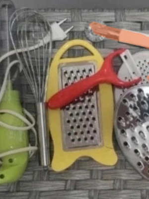 Kitchen tools set used with graters, peeler, whisk, and wire