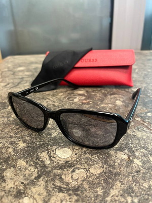 Guess women's sunglasses with red protective case and black cloth