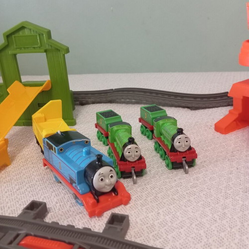 Thomas The Tank Engine train set like new with tracks, three trains, crane, and slide