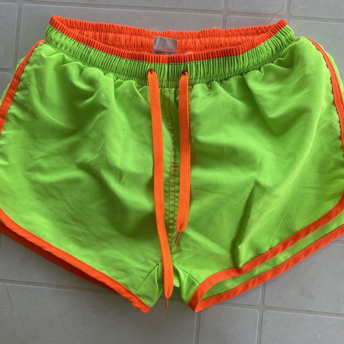 Men's swim shorts like new, fluorescent green with orange details