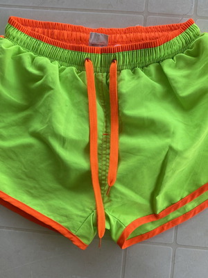 Men's swim shorts like new, fluorescent green with orange details