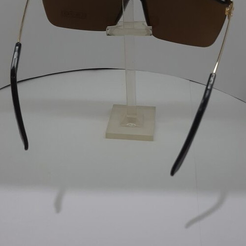 Sunglasses like new, black frame with gold details and brown lenses