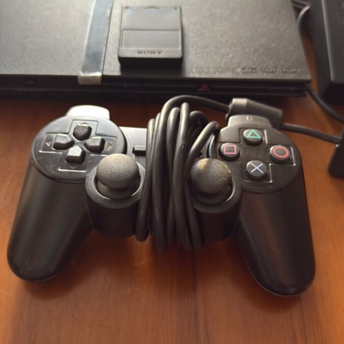 PlayStation 2 Slim console with original Sony accessories