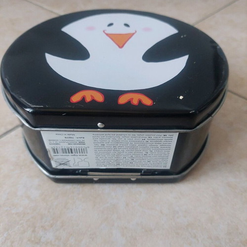 Tiger metal storage box with penguin design like new