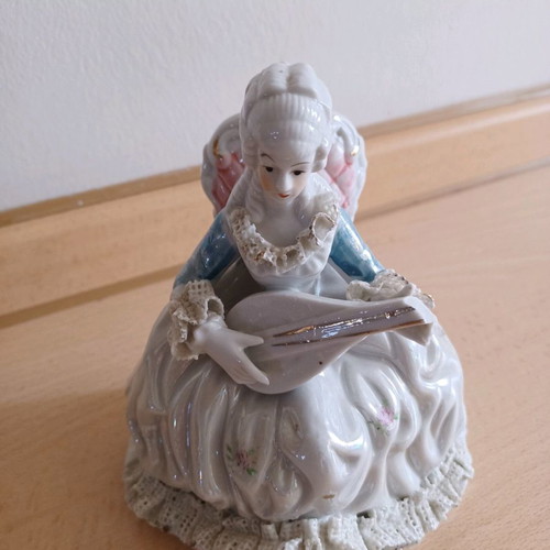 Porcelain vintage decorative girl with mandolin used