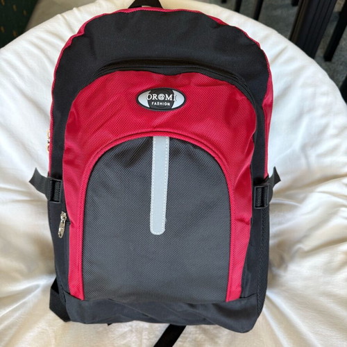 Backpack new with safety strip, black and red