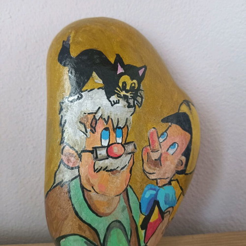 Painted stone new with acrylic colors and glossy varnish