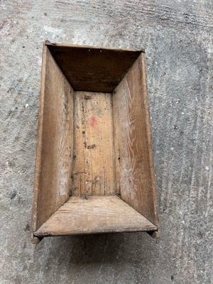 Wooden old trough used with signs of wear