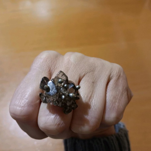 Faux ring with intricate design and adjustable size, new, silver