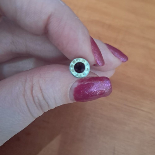 Steel stud earring with purple and white stones