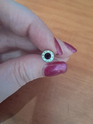 Steel stud earring with purple and white stones