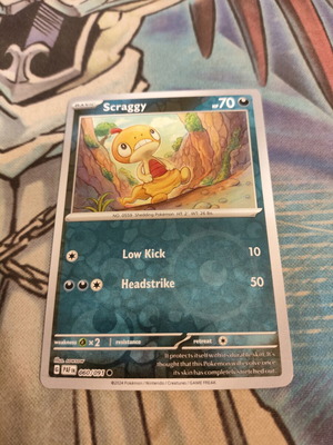 Scraggy Pokemon Card Reverse Holo like new, Paldean Fates