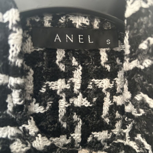 Anel short jacket-cape in black and white pattern