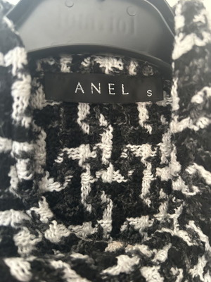 Anel short jacket-cape in black and white pattern