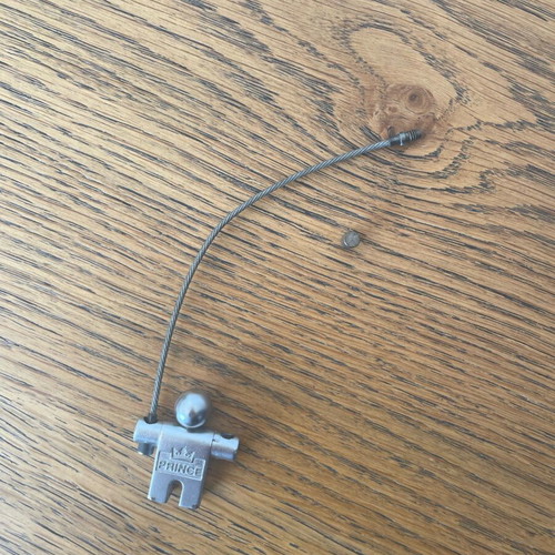 Prince vintage collectible metal keychain used, silver color